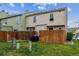 Fenced backyard with a well-maintained lawn, providing privacy and outdoor space at 1612 S Idalia Cir # A, Aurora, CO 80017