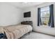 Bedroom with neutral carpet, single bed and wooden desk below window at 1612 S Idalia Cir # A, Aurora, CO 80017
