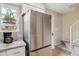 Kitchen featuring stainless steel refrigerator, hanging plant, and view to staircase at 1612 S Idalia Cir # A, Aurora, CO 80017