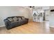Bright living room featuring hardwood floors, stylish furniture, and an open floor plan to the kitchen at 1612 S Idalia Cir # A, Aurora, CO 80017