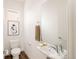 Small, clean bathroom with a toilet and sink at 5653 W 10Th Ave, Lakewood, CO 80214