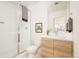 Modern bathroom with a shower and light wood vanity at 5653 W 10Th Ave, Lakewood, CO 80214