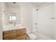 Clean bathroom with bathtub, toilet and modern vanity at 5653 W 10Th Ave, Lakewood, CO 80214