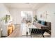 Modern living room with hardwood floors and ample natural light at 5653 W 10Th Ave, Lakewood, CO 80214