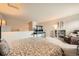Lofted bedroom with TV and desk, recliner, and bookshelf at 3205 S Walden Ct # H, Aurora, CO 80013