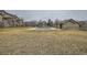 Community pool area with a covered pool and surrounding grassy area at 3205 S Walden Ct # H, Aurora, CO 80013