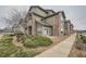 Attractive multi-story home with stone accents, well-maintained landscaping, and a welcoming entrance in a peaceful neighborhood at 3205 S Walden Ct # H, Aurora, CO 80013