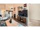 Living room featuring modern decor, fireplace, and wood flooring at 3205 S Walden Ct # H, Aurora, CO 80013