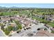 Community aerial view showing townhomes, parking, and greenspace at 8705 W Berry Ave # 204, Littleton, CO 80123