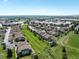 Aerial view of townhomes and landscaping showcasing the community's serene location at 8705 W Berry Ave # 204, Littleton, CO 80123