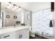 Updated bathroom with modern vanity, sleek fixtures, and a shower/tub combo at 8705 W Berry Ave # 204, Littleton, CO 80123