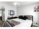 Comfortable bedroom featuring stylish decor, a ceiling fan, and natural light at 8705 W Berry Ave # 204, Littleton, CO 80123