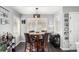 Dining room with a modern light fixture and multiple windows for natural light at 8705 W Berry Ave # 204, Littleton, CO 80123