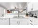 Updated kitchen featuring a stainless steel sink and updated countertops at 8705 W Berry Ave # 204, Littleton, CO 80123
