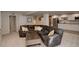 Open concept basement with a large comfortable seating area, a wet bar and plenty of natural light at 3207 Opal Ln, Superior, CO 80027
