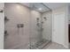 Modern bathroom features a glass enclosed shower with dual shower heads and custom tile at 3207 Opal Ln, Superior, CO 80027