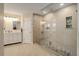 Modern bathroom featuring a glass enclosed shower with tile surround and a double sink vanity with white cabinets at 3207 Opal Ln, Superior, CO 80027