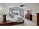 Comfortable bedroom features a large window, vaulted ceiling, and dresser at 3207 Opal Ln, Superior, CO 80027