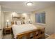 Cozy bedroom featuring a comfortable wooden bed frame, soft neutral colors, and natural light from a bright window at 3207 Opal Ln, Superior, CO 80027