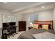 Bedroom offers a functional workspace, stylish decor, and comfortable sleeping area with bright pillows at 3207 Opal Ln, Superior, CO 80027