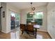 Bright dining room features hardwood floors, sliding glass door, and a modern light fixture at 3207 Opal Ln, Superior, CO 80027