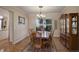 Formal dining room with hardwood floors, classic furnishings, and a large window at 3207 Opal Ln, Superior, CO 80027