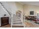 Inviting home entryway featuring a curved staircase and hardwood floors at 3207 Opal Ln, Superior, CO 80027