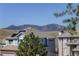Residential neighborhood with mountain views under a blue sky at 3207 Opal Ln, Superior, CO 80027