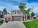 Traditional two-story home with brick accents, attached garage, and green lawn at 3207 Opal Ln, Superior, CO 80027