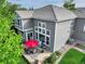 Back exterior view of a home with a beautiful patio, well-maintained lawn and a two-story facade at 3207 Opal Ln, Superior, CO 80027