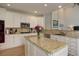 Bright kitchen with white cabinets, granite countertops, and stainless steel appliances at 3207 Opal Ln, Superior, CO 80027