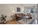 Comfortable living room boasting hardwood floors, area rug, and large window at 3207 Opal Ln, Superior, CO 80027