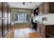 Functional office features custom built-ins, hardwood floors, and a large window at 3207 Opal Ln, Superior, CO 80027