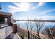 Wide open back deck overlooks a calm and serene waterfront with blue skies at 7700 W Grand Ave, Littleton, CO 80123