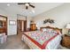 Bright bedroom with a vaulted ceiling, plush carpet, and a view of the hall at 7700 W Grand Ave, Littleton, CO 80123