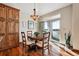 Cozy dining room with a wooden table and chairs, plus sliding glass doors to the outside at 7700 W Grand Ave, Littleton, CO 80123