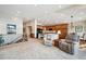 Open-concept living area featuring a staircase and leading into the kitchen at 7700 W Grand Ave, Littleton, CO 80123