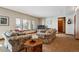 Spacious living room with neutral walls, carpeted floors, and views of the water at 7700 W Grand Ave, Littleton, CO 80123