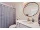 Bright bathroom features a new vanity with quartz counters and gold fixtures at 1137 Hummingbird Cir, Longmont, CO 80501