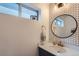 Modern bathroom with hexagonal tile accent wall, new vanity, and stylish fixtures at 1137 Hummingbird Cir, Longmont, CO 80501