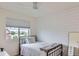 Cozy bedroom with a large window and white shiplap accent wall at 1137 Hummingbird Cir, Longmont, CO 80501