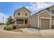 Charming two-story home with covered porch and detached garage at 1137 Hummingbird Cir, Longmont, CO 80501