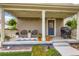 Covered front porch with grill, seating, string lights, and decor at 1137 Hummingbird Cir, Longmont, CO 80501