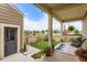 Covered front porch with black chairs, rug, and American flag at 1137 Hummingbird Cir, Longmont, CO 80501