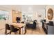 Open-concept living room and dining area features hardwood floors and lots of natural light at 1137 Hummingbird Cir, Longmont, CO 80501