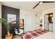 Comfortable main bedroom with dark accent wall and ensuite bathroom at 1137 Hummingbird Cir, Longmont, CO 80501