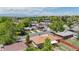 Aerial view of the neighborhood with mature trees and mountain views in the background at 8774 Princeton St, Westminster, CO 80031