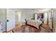 Cozy bedroom featuring a ceiling fan, closet, and a patterned comforter on a bed with an eye-catching area rug at 8774 Princeton St, Westminster, CO 80031