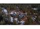 Secluded mountain home surrounded by trees, snow, and long driveways for privacy at 4446 Songbird Ln, Evergreen, CO 80439