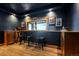 Stylish bar area with a view, featuring wood counters, seating and tasteful decor at 4446 Songbird Ln, Evergreen, CO 80439